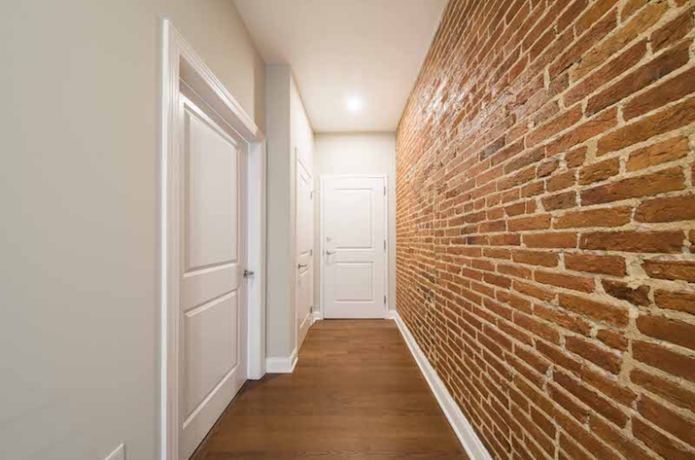 Historic touches include exposed brick walls 