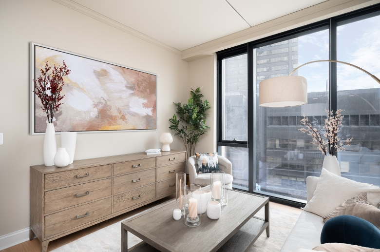 Floor-to-ceiling windows feature solar shades