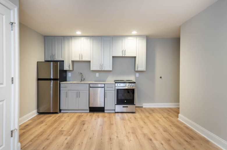 Open concept kitchen with hardwood flooring