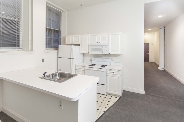 Kitchen at 1222 Arch Street featuring white appliances and cabinets